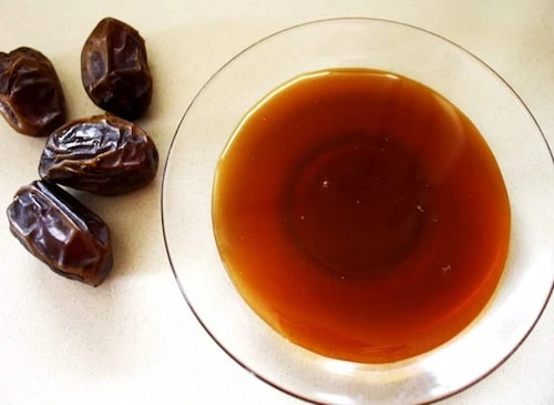 تصویر 3 از شیره خرما با رنگ تیره و بوی طبیعی