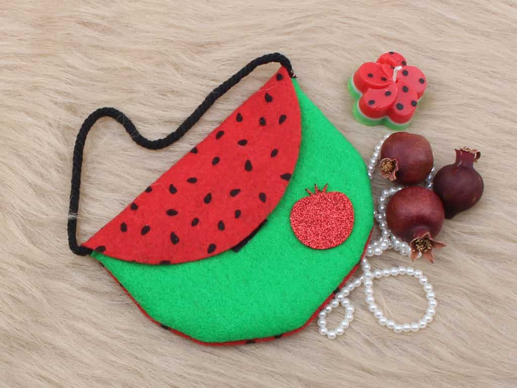 کیف نمدی هندوانه ای مناسب نگهداری وسایل کوچک و لوازم شخصی